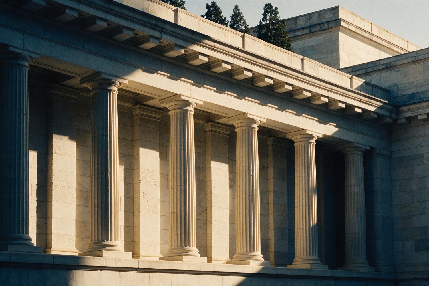 Neoclassical stone colonnade in late afternoon light
